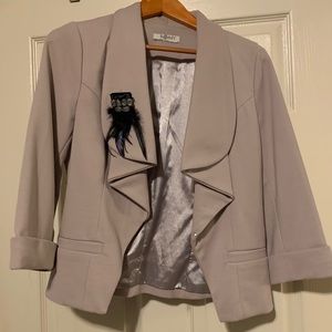 Dress jacket with vintage brooch.